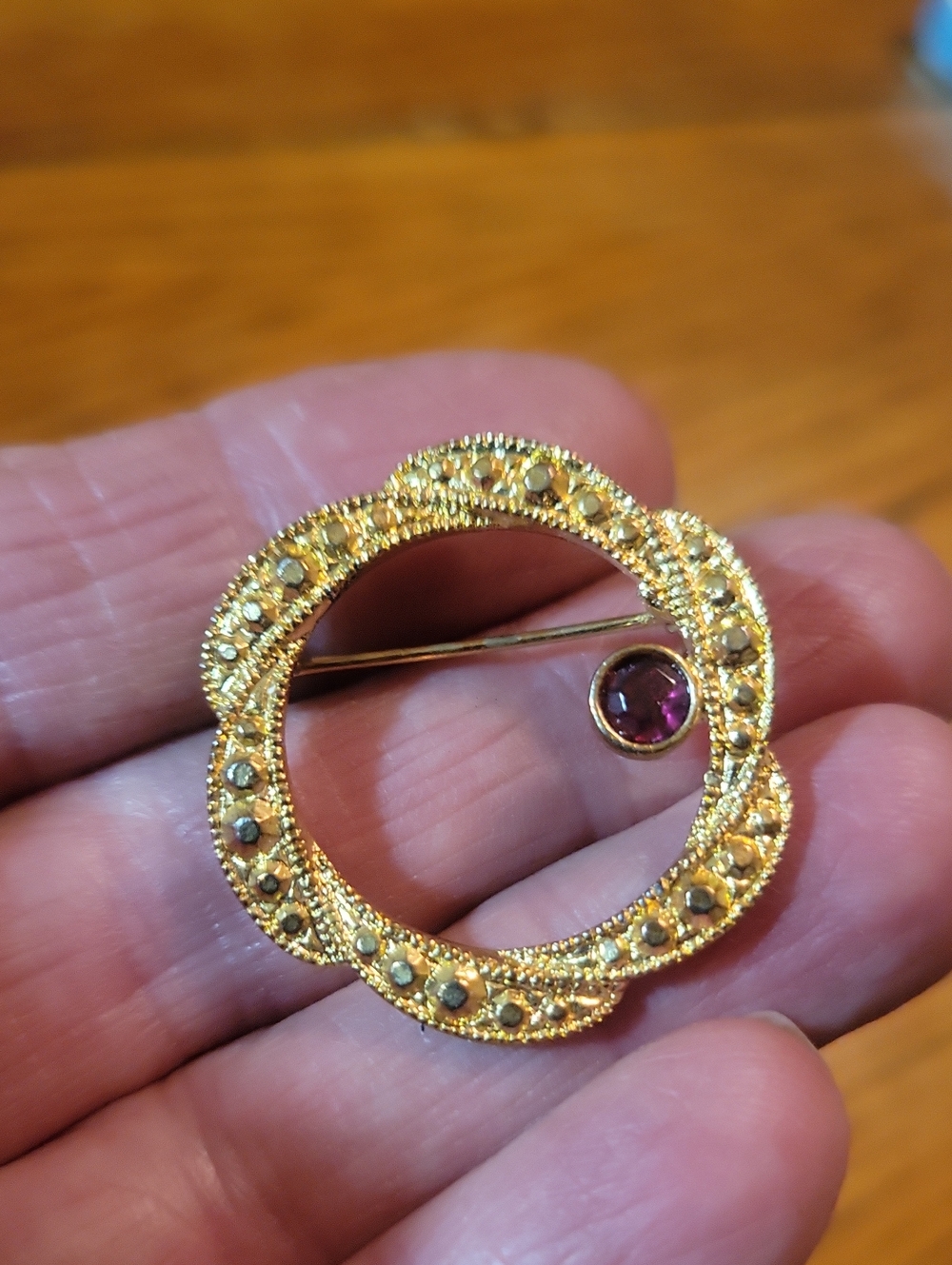 Gold-Tone Circle Brooch with Purple Accent Stone